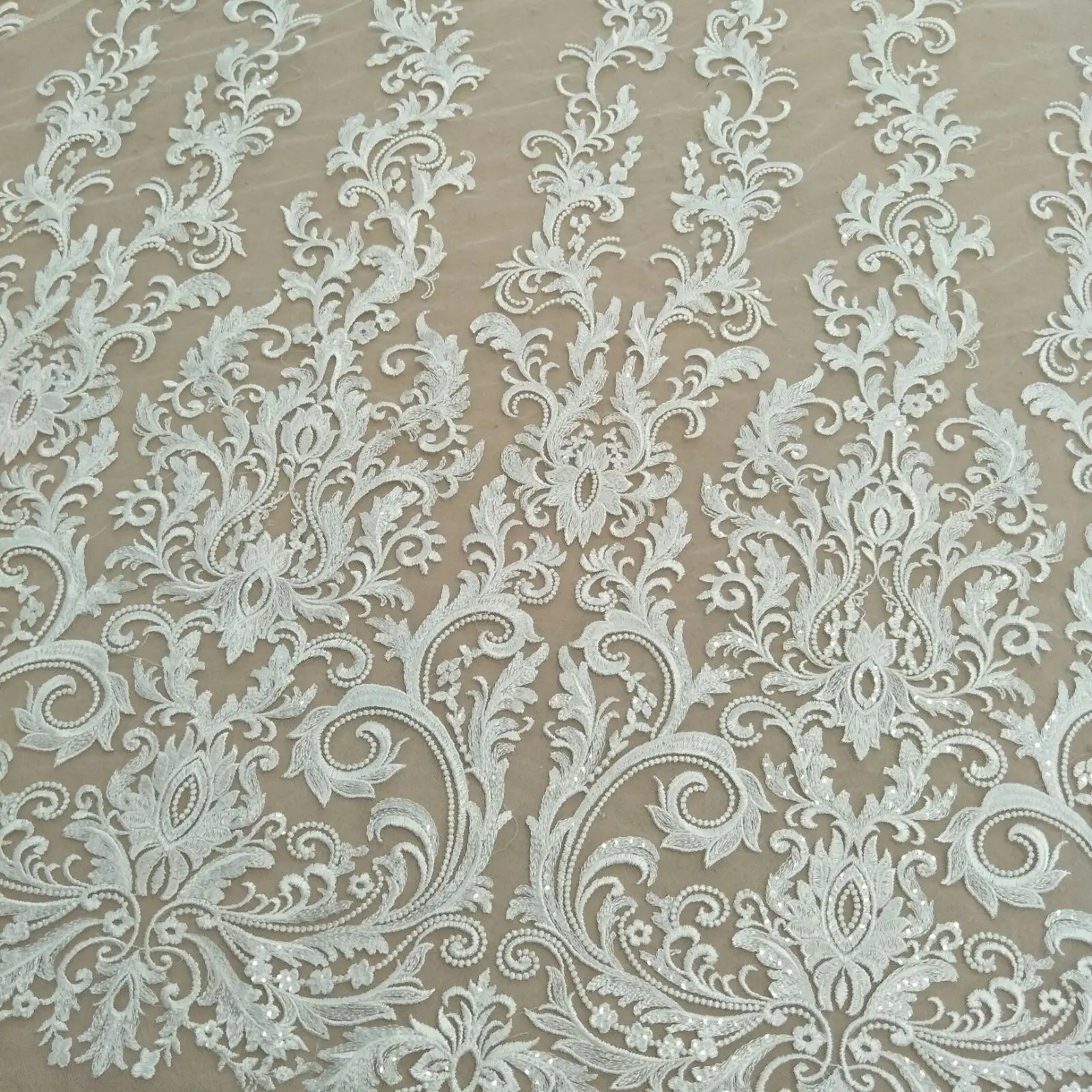 2024 The latest symmetrical diy wedding dress lace with sequins 130cm width sell by yard