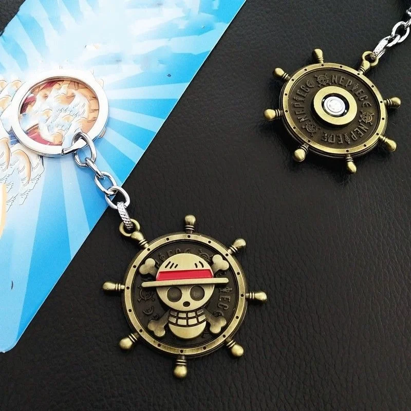 Accesorio de anime, llavero giratorio de aleación con el logo de Luffy de One Piece.