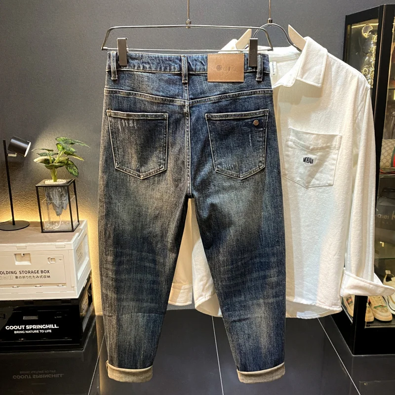 กางเกงยีนส์ทรงเกวงขาสั้นเก้าส่วนสไตล์อเมริกันสุดหรูสำหรับผู้ชาย รุ่นใหม่สุดเทรนด์ ทรงเข้ารูปสวยงาม สวมใส่สบายๆ