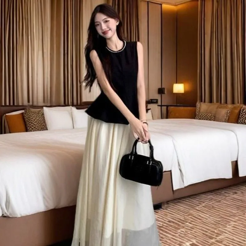 Camisas sin mangas negras elegantes para mujer, faldas de gasa, trajes de dos piezas, camisetas sin mangas negras ajustadas para verano 2025, trajes de faldas