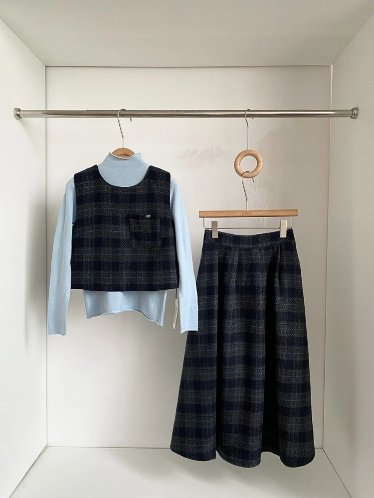 Autumn and winter new trendy age reducing versatile checkered vest+long sleeved knitted pullover+half skirt three piece set