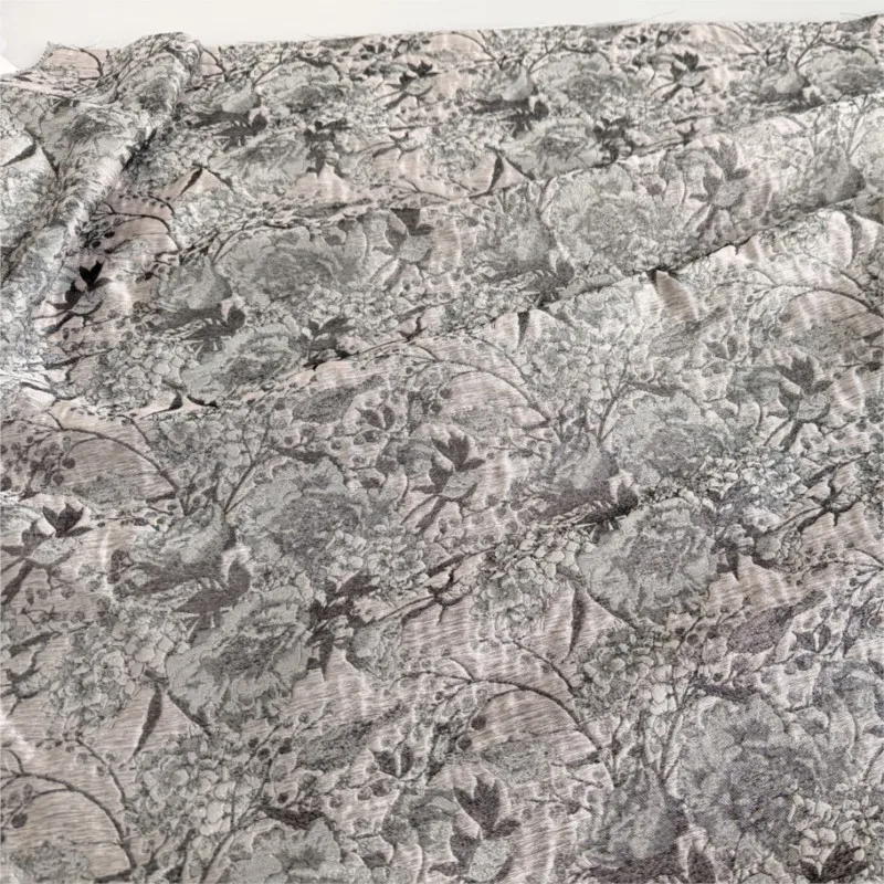 The fabric for women's evening gowns is a thin and slightly transparent acetate tencel jacquard made of seep yarn
