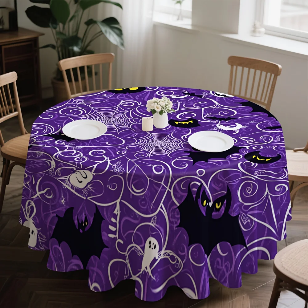 One Halloween-themed tablecloth, featuring a pattern of spooky spider webs and bats.zyc
