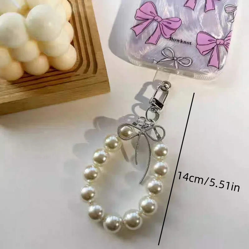 

Advanced feeling electroplated silver pearl mobile phone strap, sweet bow headphone case, bag, car key pendant