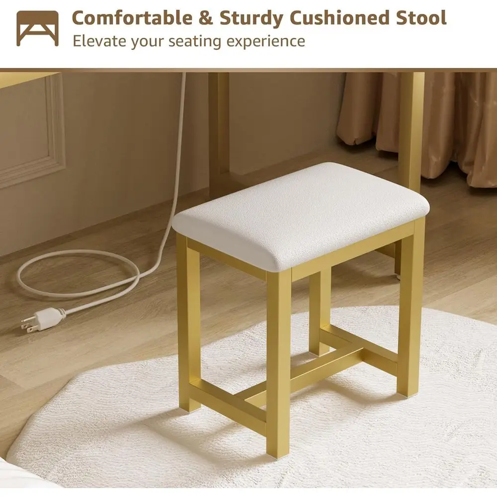 Tocador de maquillaje blanco y dorado con espejo y luces, cajones, sillas de tela y toma de corriente para dormitorio moderno