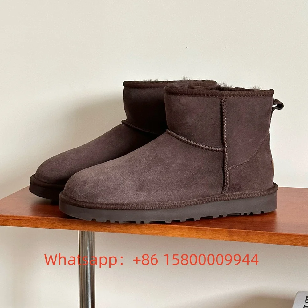 2025 Botas de nieve de moda cálidas y antideslizantes de cachemira para hombres y mujeres de caña media baja