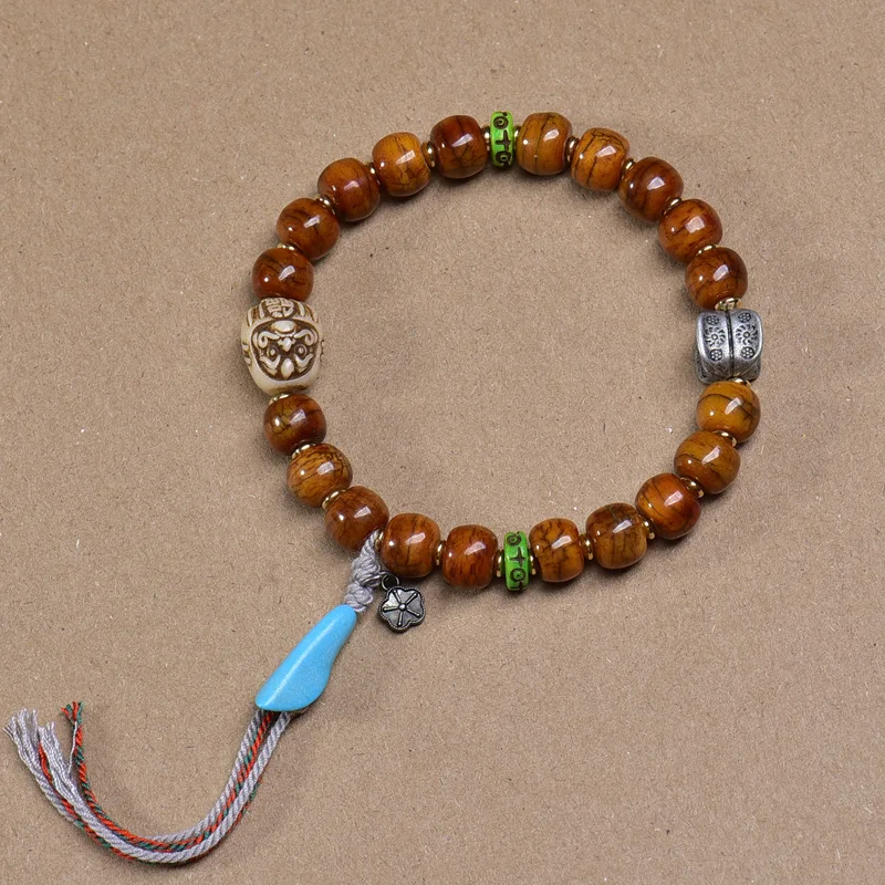 

Tibetan-Style Reclaimed Yak Bone Carved Bead Bracelet with Tibetan Silver, Glass, Agate, and Cinnabar Vintage Bracelet