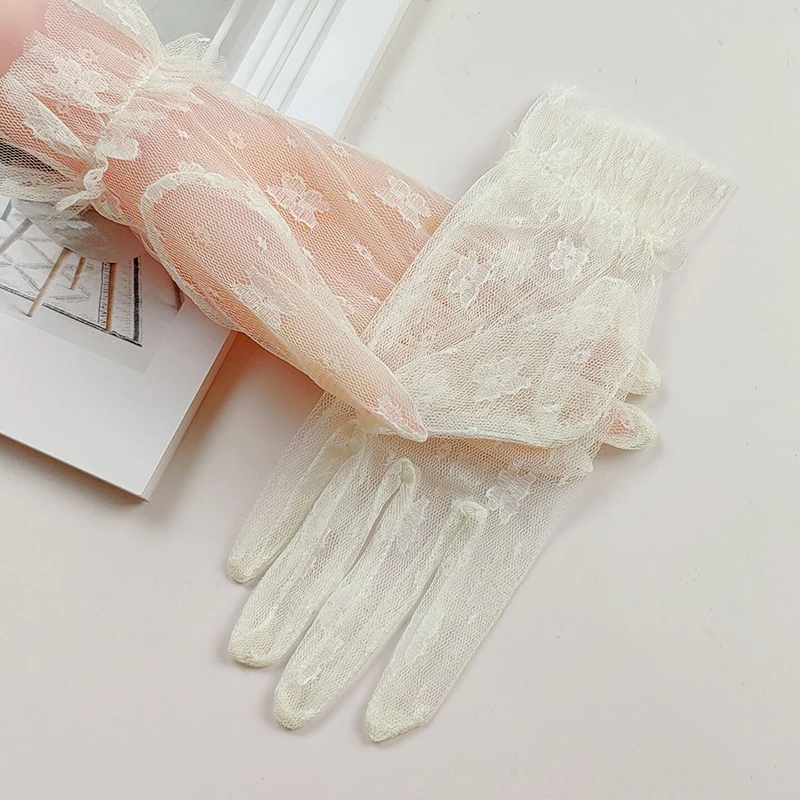 Guantes de encaje de flores huecas blancas coreanas, malla Sexy, vestido de novia corto, accesorios de fotografía, protector solar de verano para