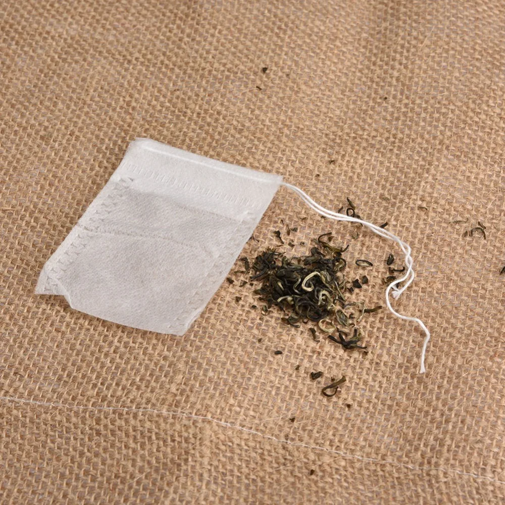 Drawstring Closure Empty Tea Bags Non-Woven Material Disposable Design Non-Woven Tea Bags White Color 5.5*7cm Size