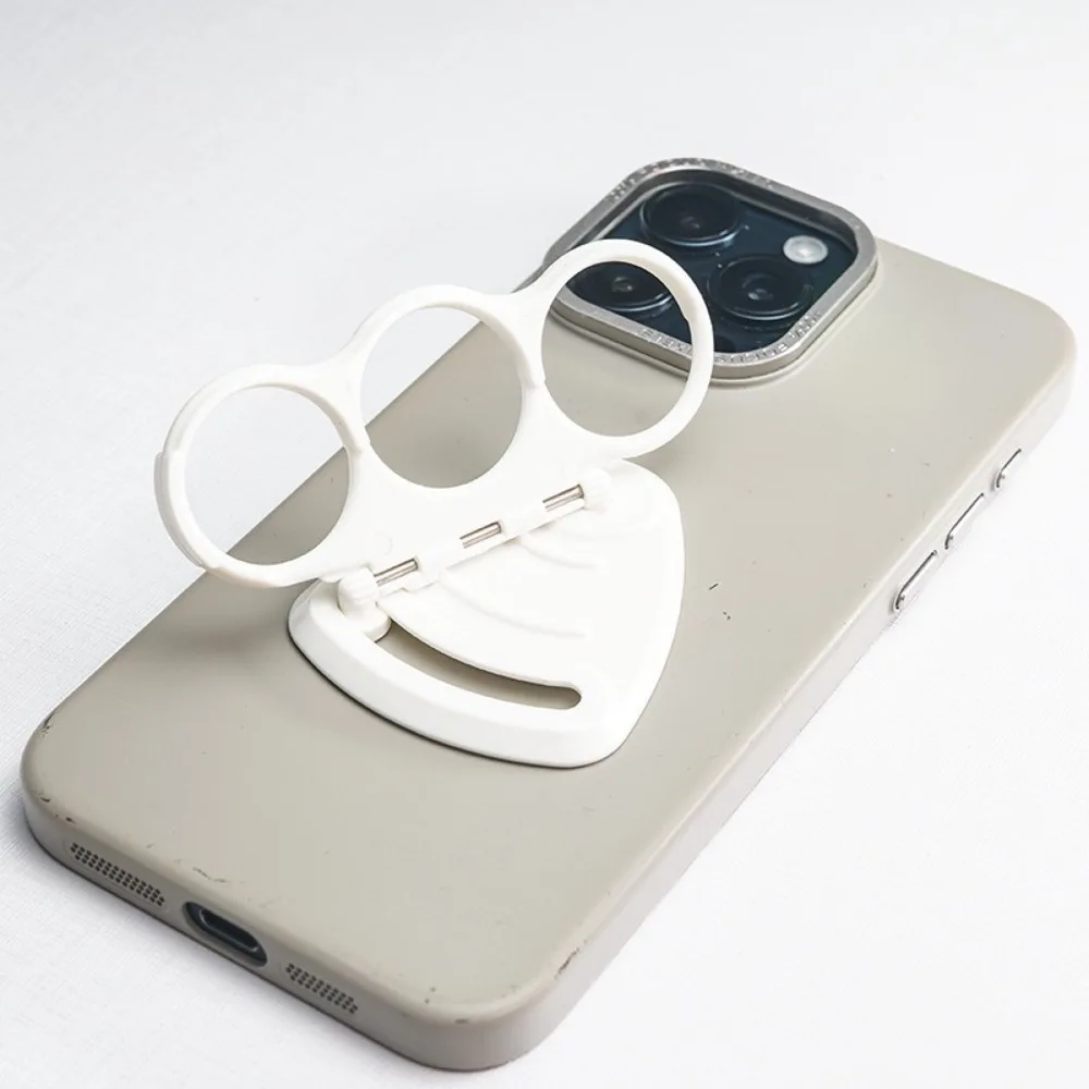 

Novel and Unique Finger Hole Phone Ring Buckle Foldable Stable Mobile Phone Holder White Movable Phone Accessories Adults