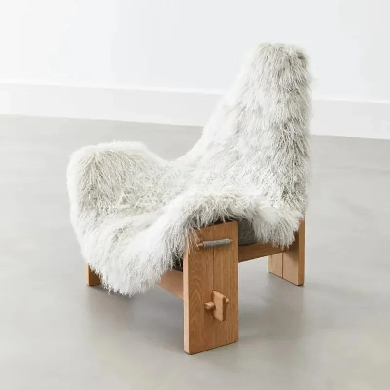 A Italian light luxury minimalist studio club clothing store white long hair lazy chair, casual single chair