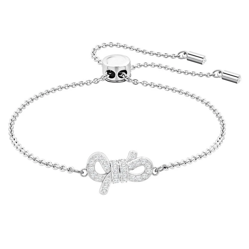 

Серебристый браслет с бантом в технике паве и регулируемой застежкой-слайдером