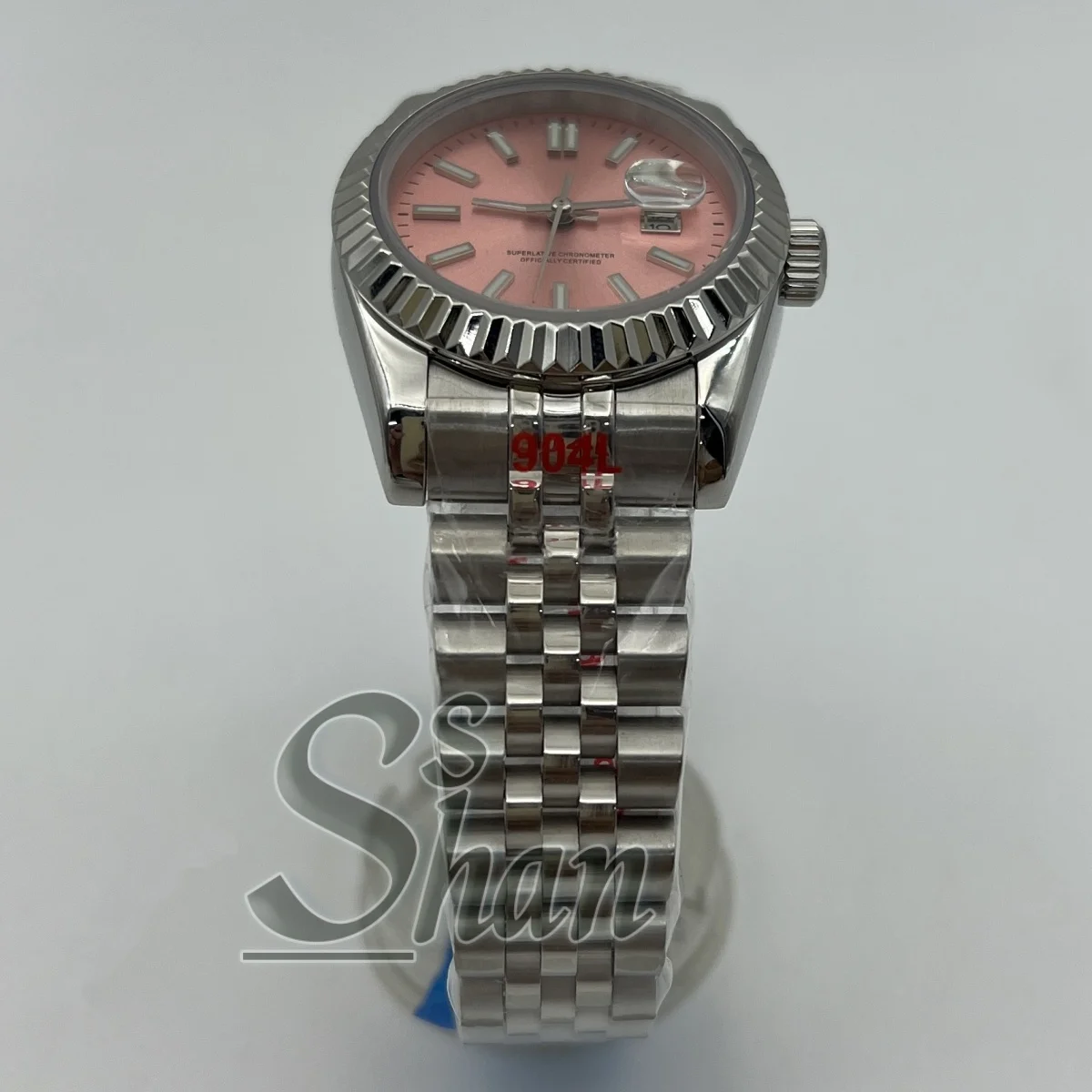 31mm luxury ladies mechanical watch features a grooved bezel with sapphire crystal and is powered by the NH05 automatic movement