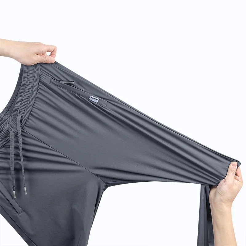 رقيقة تنفس السراويل الرجال 7XL الحرير الجليد الصيف التجفيف السريع فضفاض مستقيم مرونة عالية السراويل الرياضية الركض سراويل تقليدية