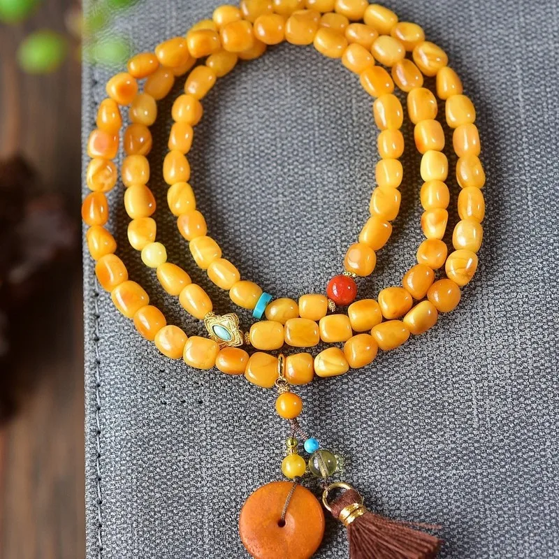 Natural Russian bracelet 5mm featuring three strands of beads in a chicken oil yellow hue made from raw amber