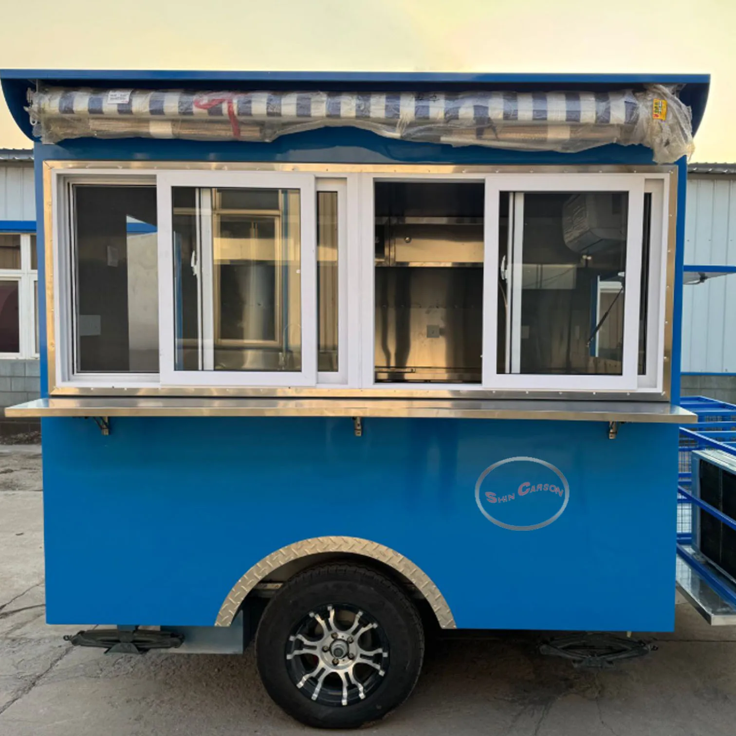 

Bright blue outdoor food trailer with a simple and practical design, a great helper for mobile catering business