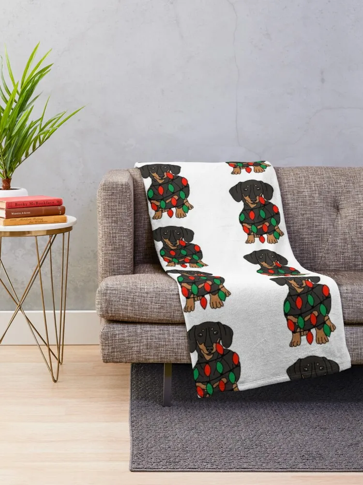 Dachshund Dog with Christmas Lights Wrapped Around Its Body – Festive and Adorable Design Description: Get into th Throw Blanket