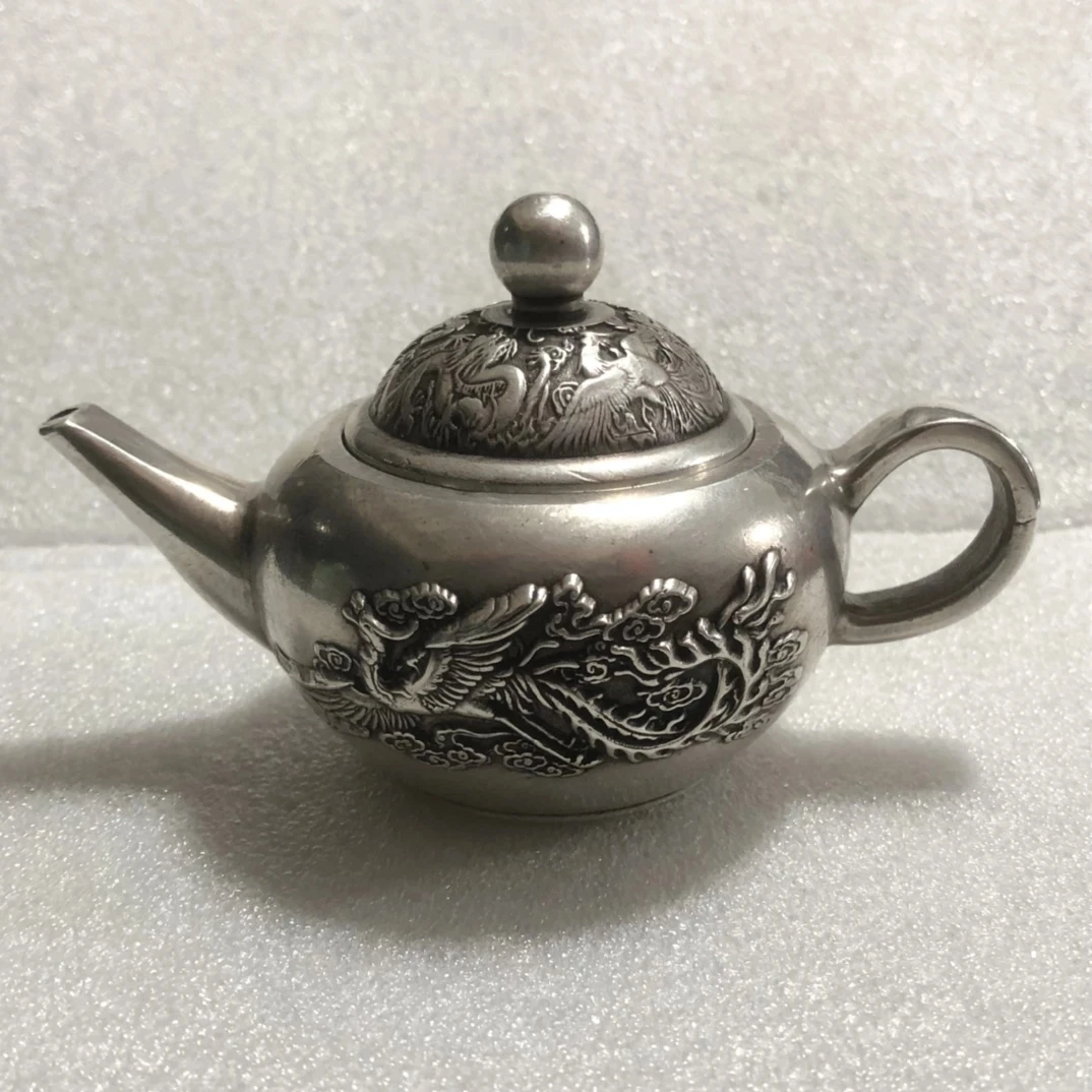 

Exquisite collection of Chinese Archaize silver-plated dragon and phoenix teapot