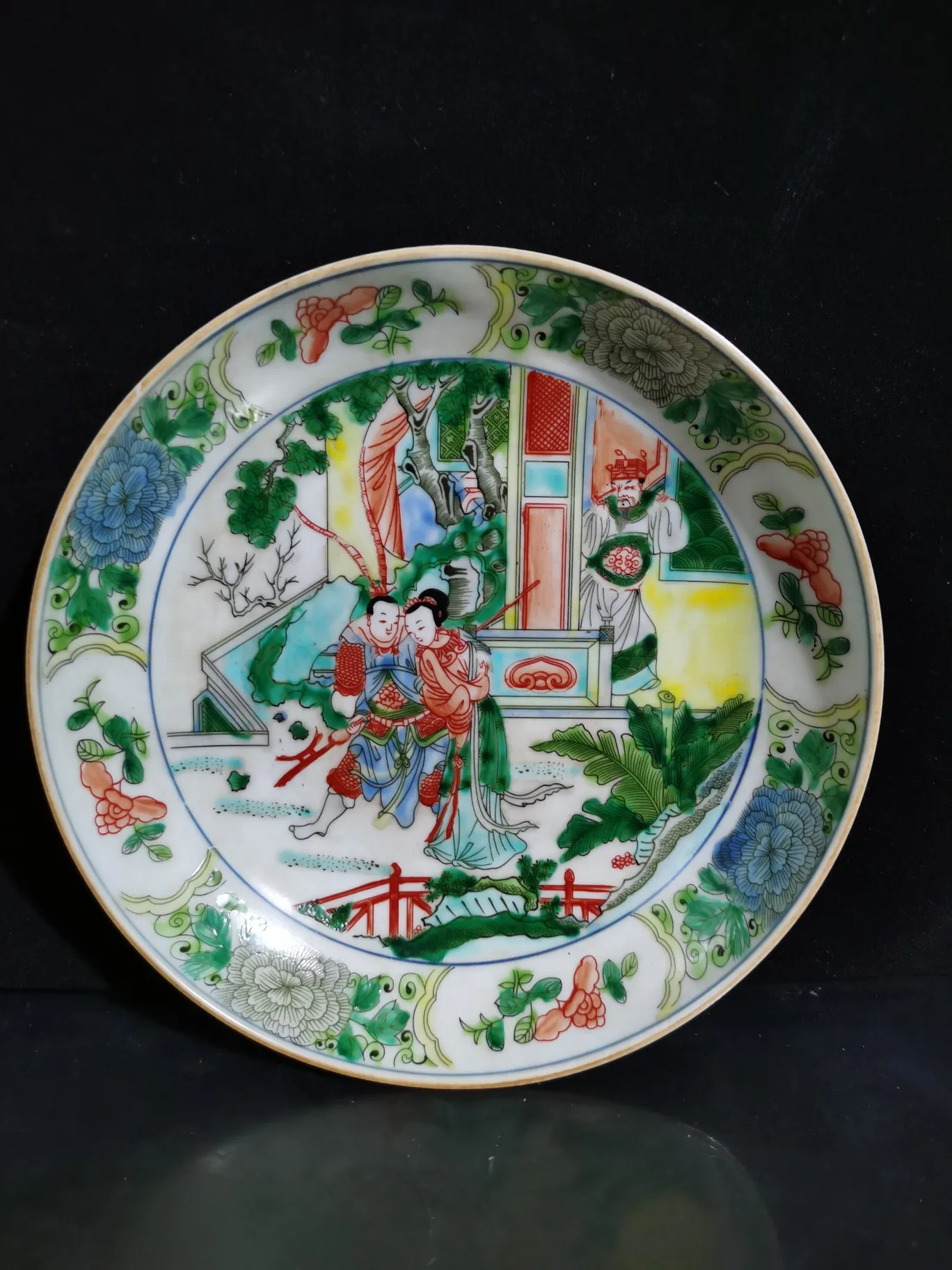 

A porcelain figurine of a coiled plate