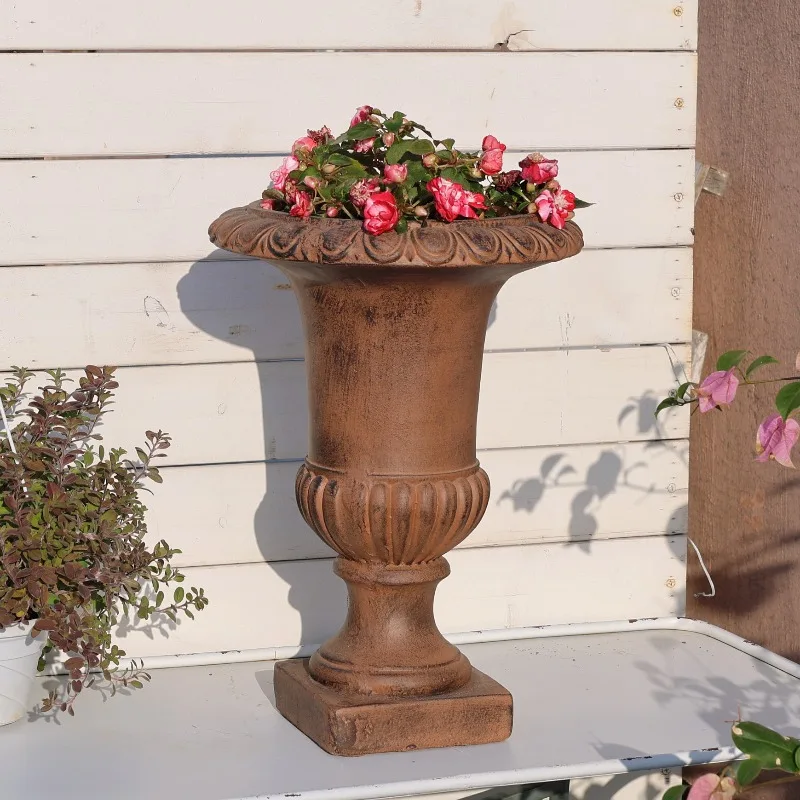 Distressed vintage brown high-stemmed Roman flowerpot, simple indoor balcony, outdoor garden, courtyard decorative ornament