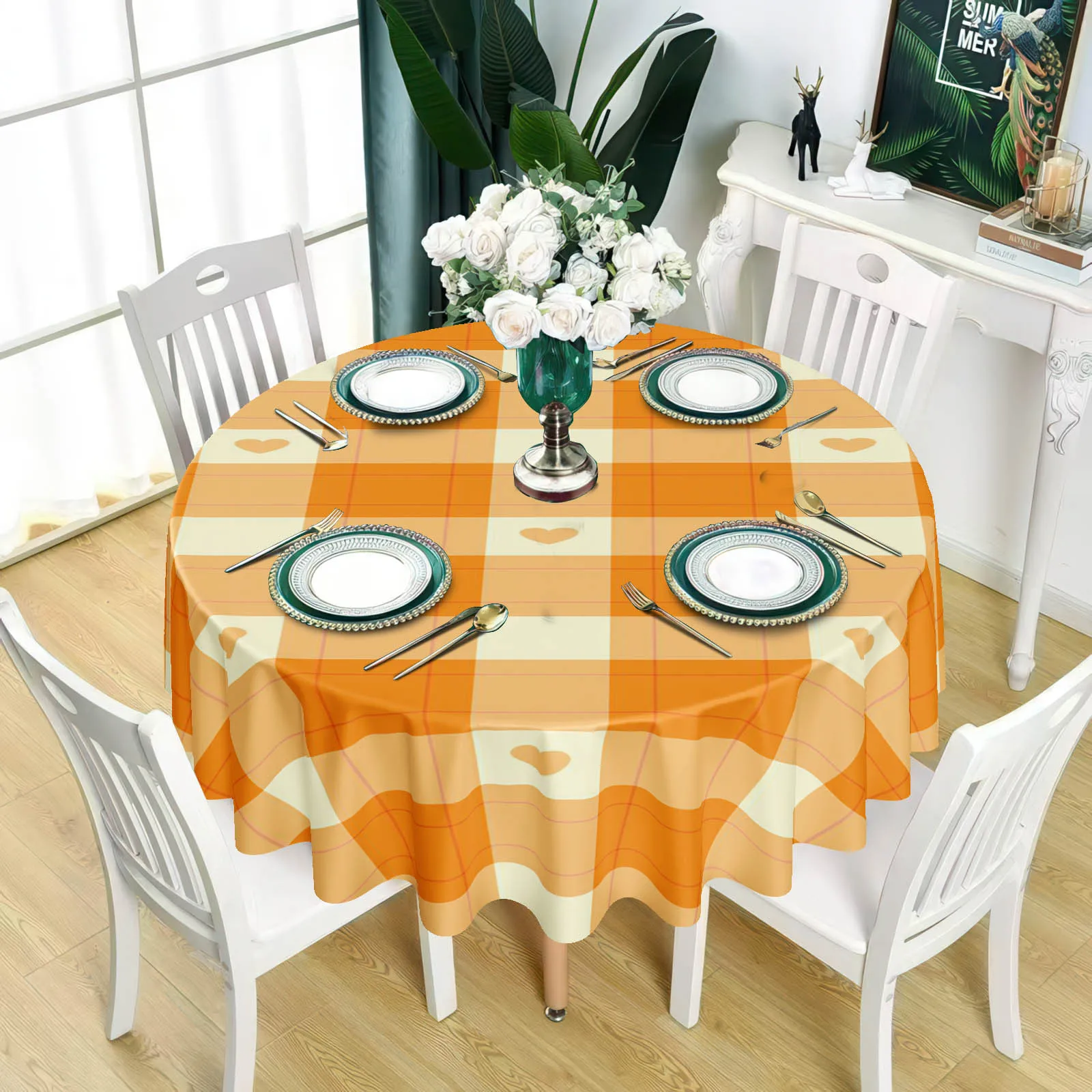 A tablecloth with an orange and white checkered pattern interspersed with small heart-shaped designs