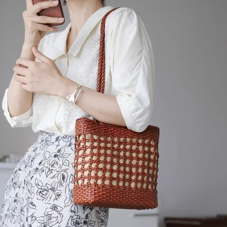 

Bucket handbag, French hollowed out genuine leather vintage hand woven bag, single shoulder crossbody bag