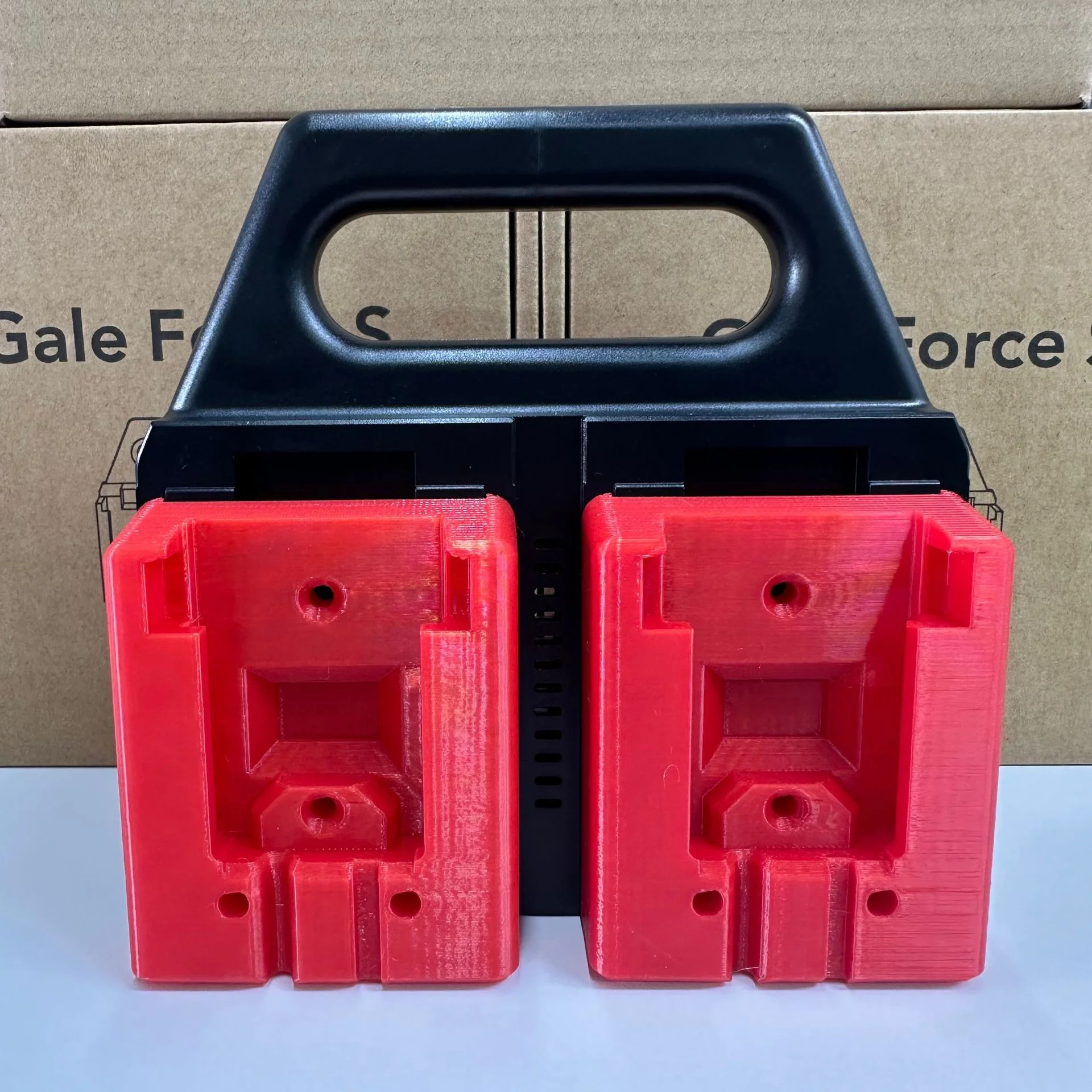 

Portable 4-slot battery organizer for Milwaukee 18V tools. Handle & non-slip base. Ideal for job sites & tool bags.