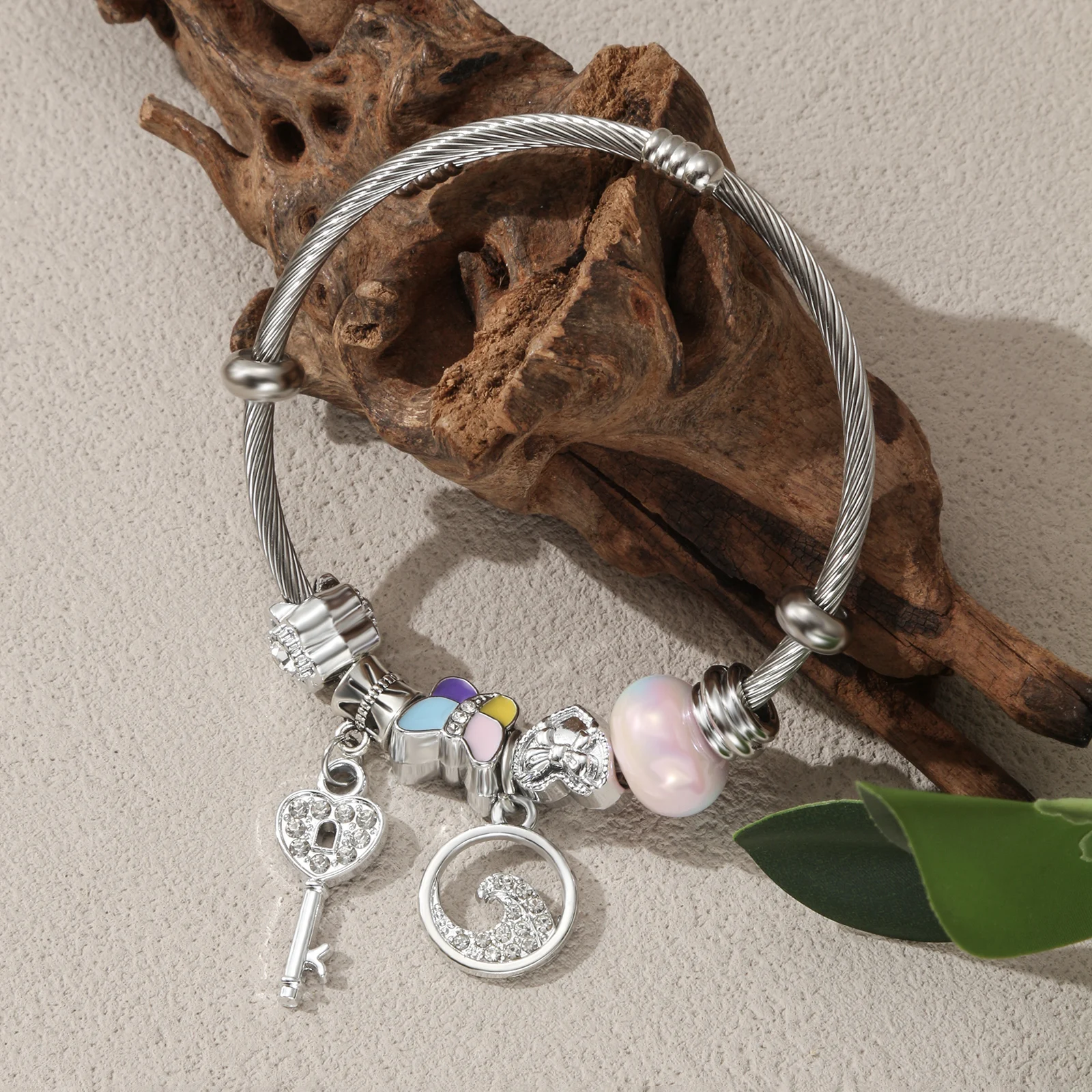 

Silver Tone Charm Bangle with Pastel Bead Butterfly and Key Pendant for Women