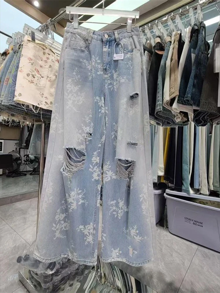 Novedad de verano para mujer, pantalones de suelo a la moda y con estilo, pantalones vaqueros de pierna ancha rasgados con estampado floral retro de estilo americano