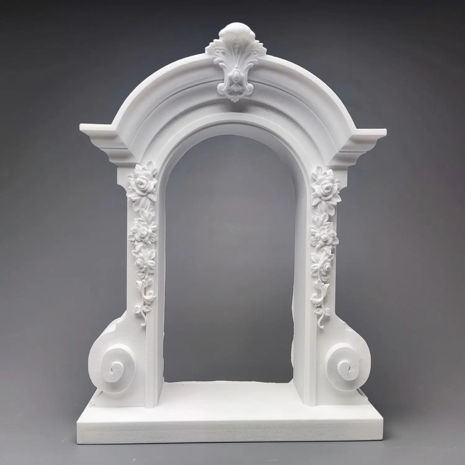 Rococo style floral archway decorations, architectural structures, plaster statues, art sketches, and sculptures.