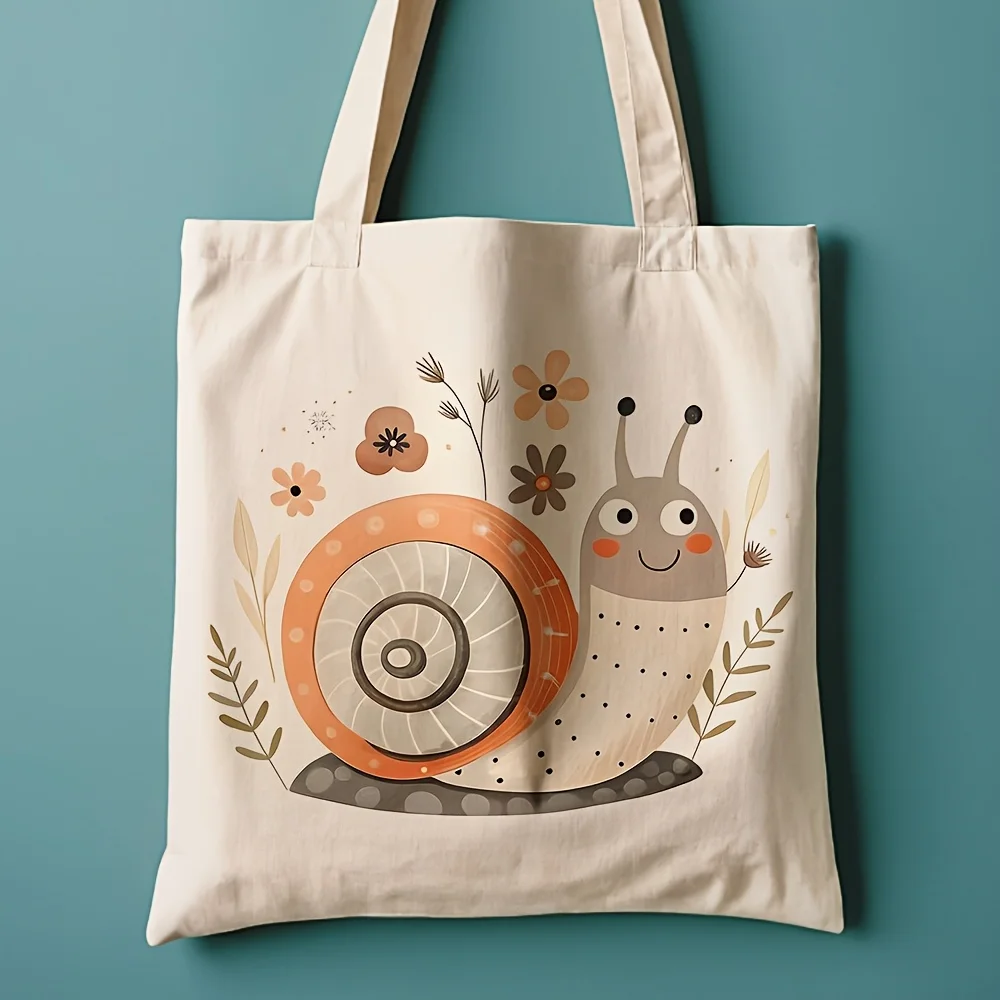A Cute snail pattern printed canvas tote bag, suitable for daily use, shopping, school, and travel