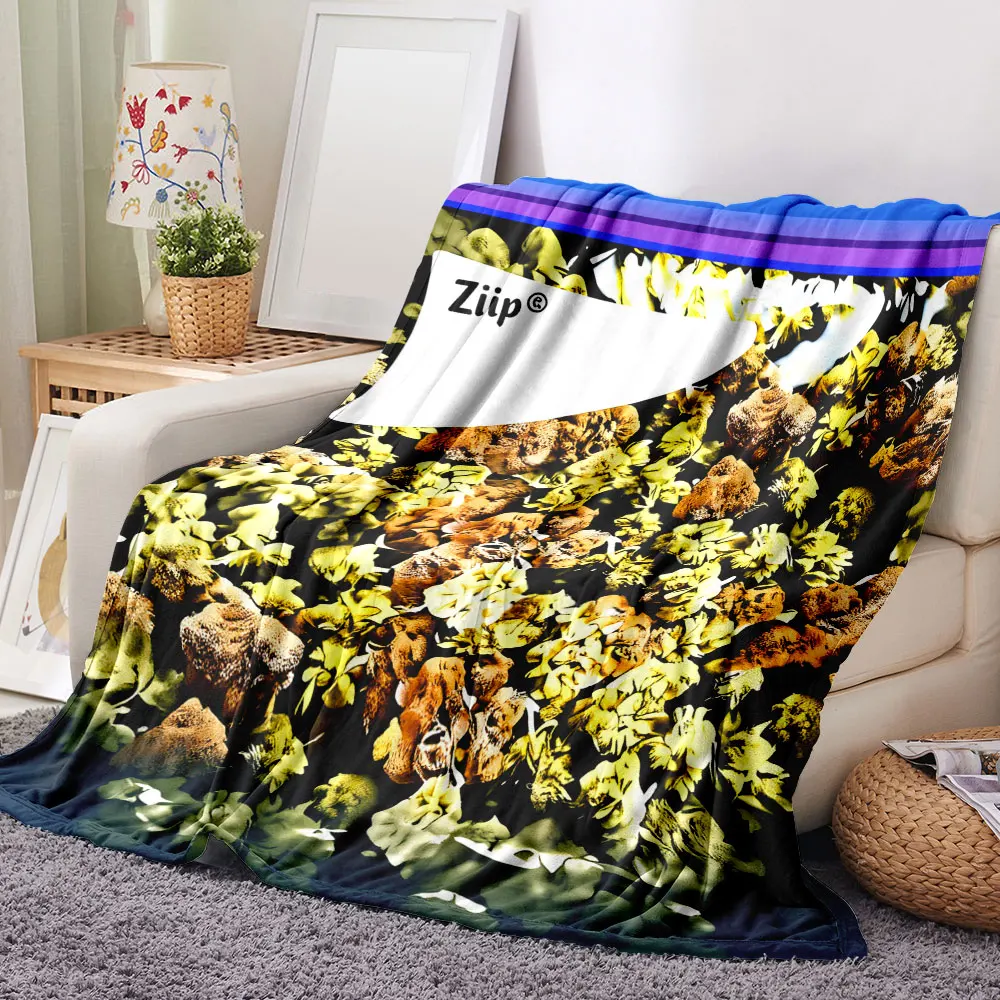 Plant Art Blanket – A soft and cosy throw featuring a rich, dark base adorned with a chaotic yet intricate pattern of yellow-gre