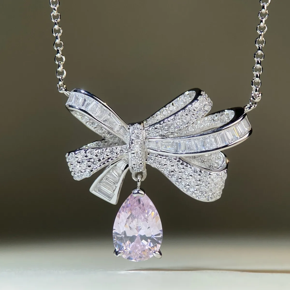 Brogan drop necklace for women, made of PT950 platinum and set with full diamonds and luxurious hued zirconia pendant.