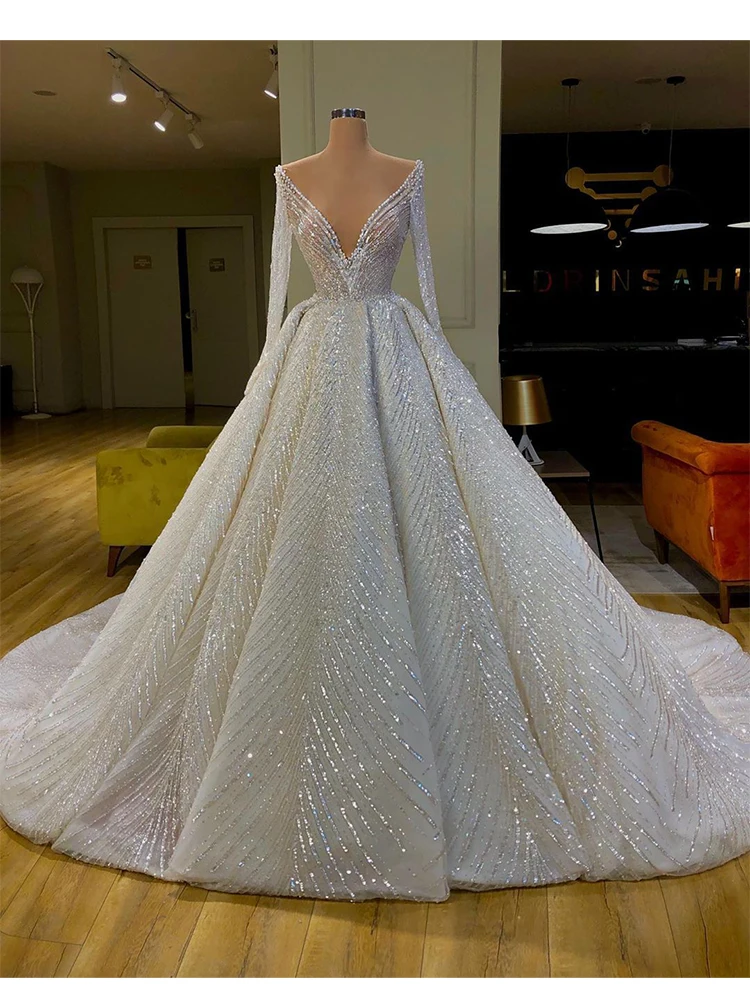 

Sparkly Ball Gown Wedding Dresses Long Sleeves V Neck Sequins 3D Lace Appliques Ruffles Zipper Bridal Gowns Vestina De Novia