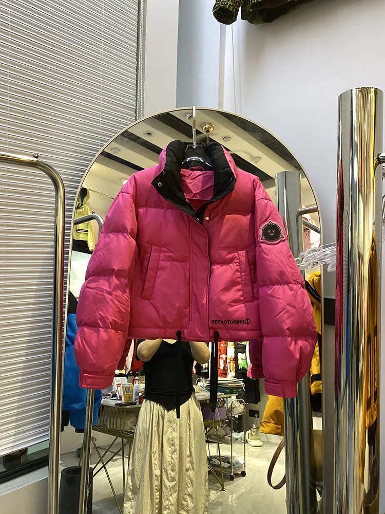 Chaqueta de plumón cálida con capucha para mujer, chaqueta de plumón de pato blanco a la moda con temperamento elegante, novedad de invierno de 2025