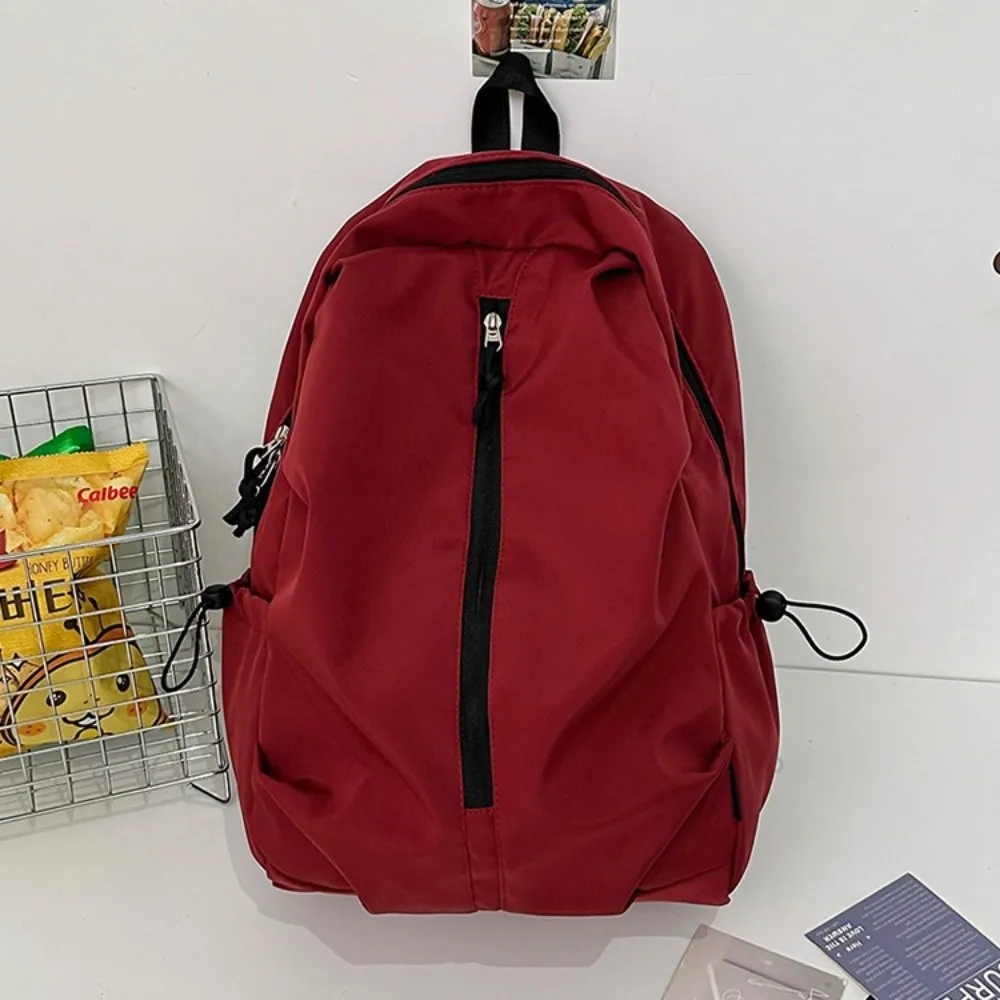 حقيبة ظهر عصرية ذات سعة كبيرة وبسيطة مقاومة للماء بلون سادة حقيبة جامعية بسحاب حقيبة كتب خفيفة الوزن في الهواء الطلق