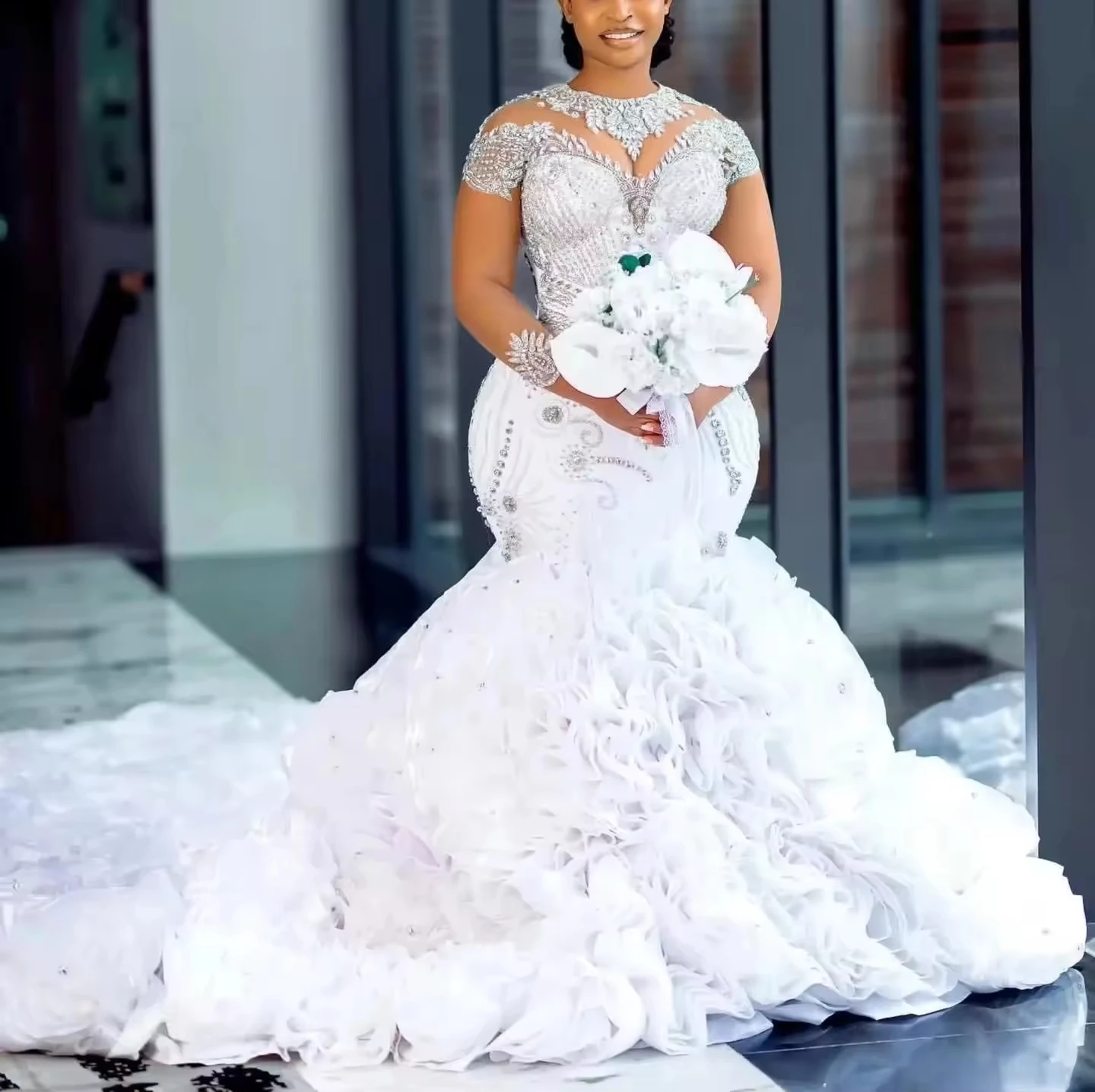 

Customized Mermaid Wedding Dress Long Sleeve Sheer Beaded Neck Shinny Stone Beaded Fish Tail Bridal Gown with Cascading Ruffles