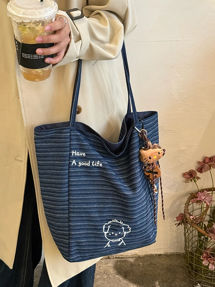 

2025 New Striped Embroidered Canvas Double sided Women's Bag Fashion and Leisure Large Capacity Women's Commuter Shoulder Bag