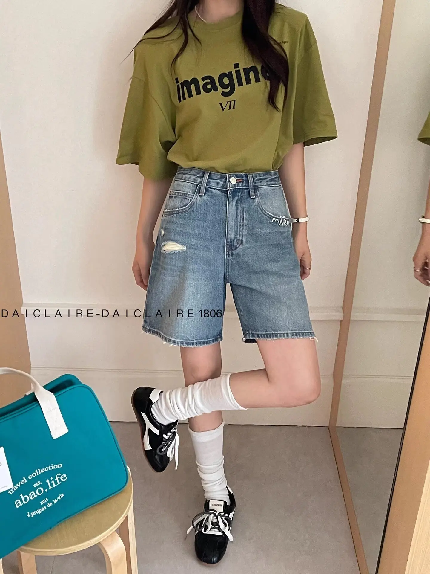 

Trendy and versatile denim shorts for women in summer, with wide legs and high waisted, perforated, and non elastic A-line mid l