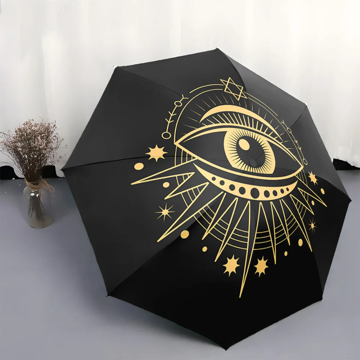 

Automatic Folding Umbrella Golden celestial eye with stars and abstract rays. Portable collapsible design, casual outdoor acce