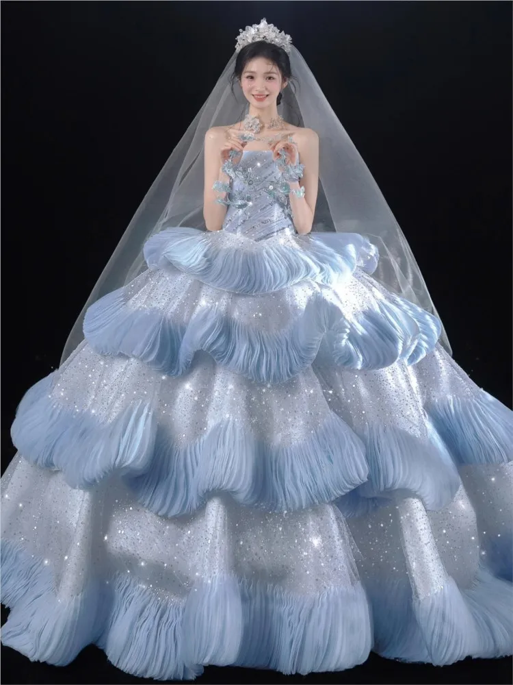 A new blue strapless theme photography haute couture dress with tail as the main fabric
