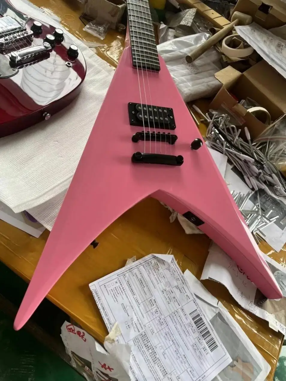 In Stock Pink V-shaped  Electric Guitar Shark Fin Inlay Black Hardware