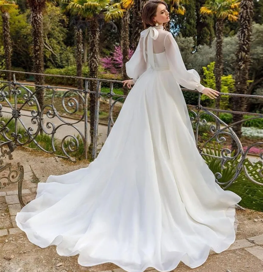 2025 A-line Abito da sposa in organza Collo ad alta illusione Maniche lunghe a sbuffo Bottoni Abiti da sposa Abiti da sposa personalizzati