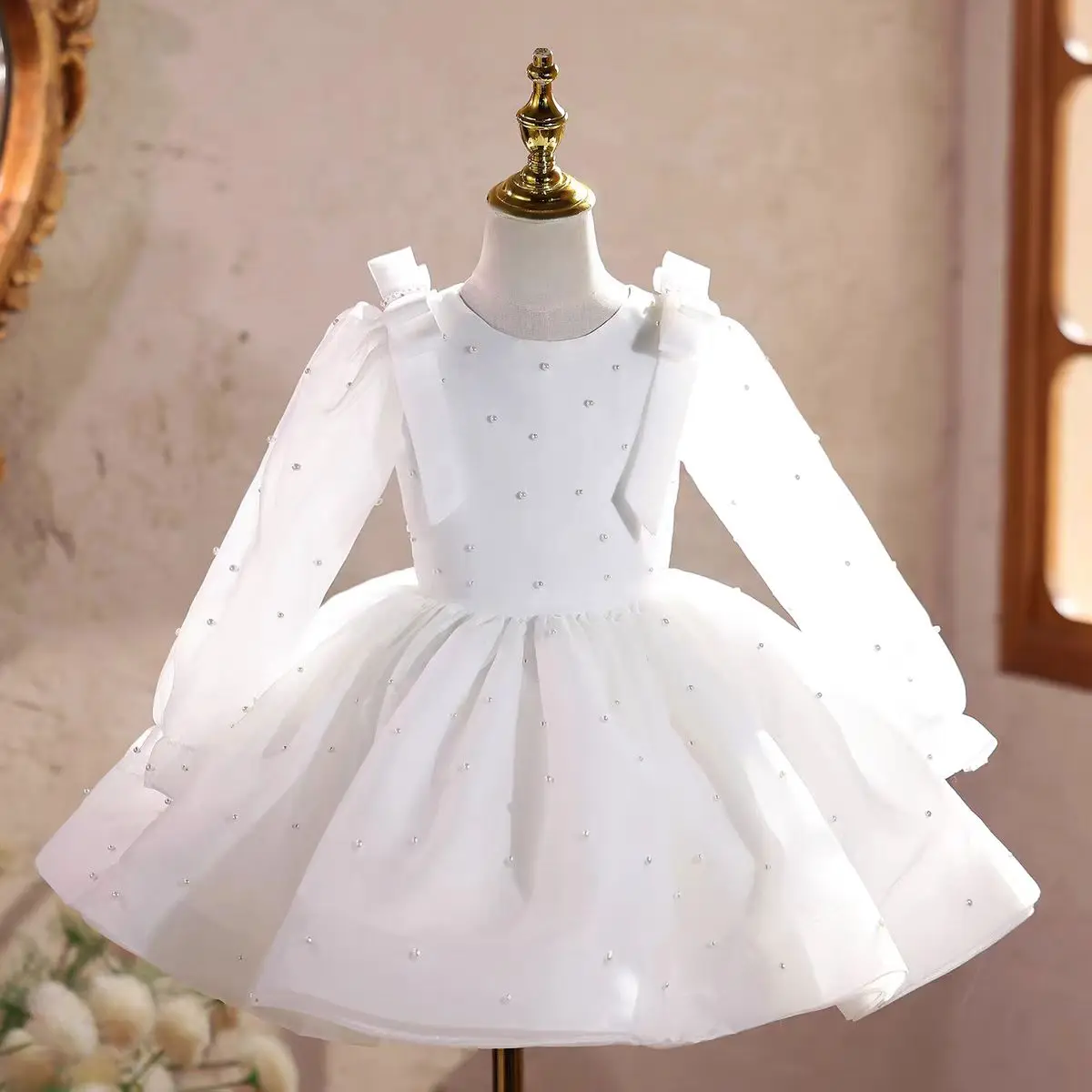 

Jill Wish M047 White Long-Sleeve Flower Girl Dress with Pearl Embellishments & Sheer Organza Sleeves – Giant Back Bow Elegant