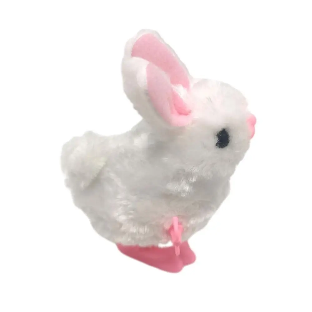 Nuevo Conejo de peluche blanco, juguete interactivo de cuerda con mecanismo de relojería, juguete para saltar de Pascua para niños