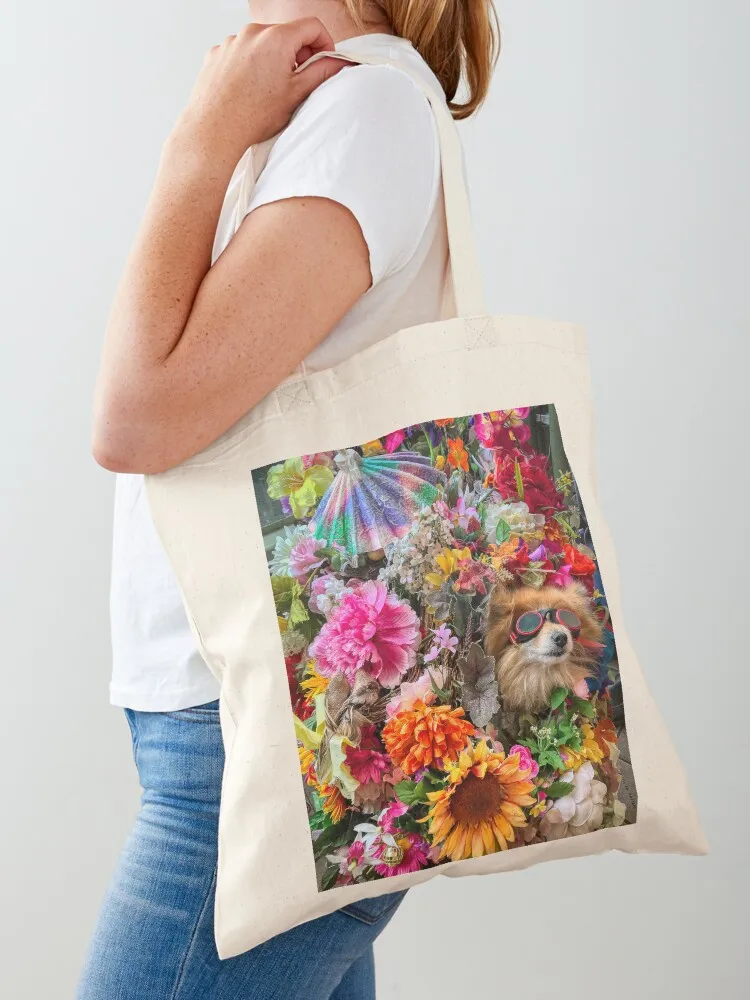 

Pomeranian dog in a stroller wearing goggles surrounded by colorful flowers Seattle Tote Bag