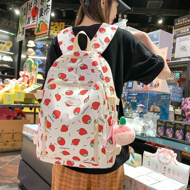 Linda mochila escolar para niñas con estampado de fresas y correa ancha para el hombro para reducir el carga y proteger el Campus de la mochila de