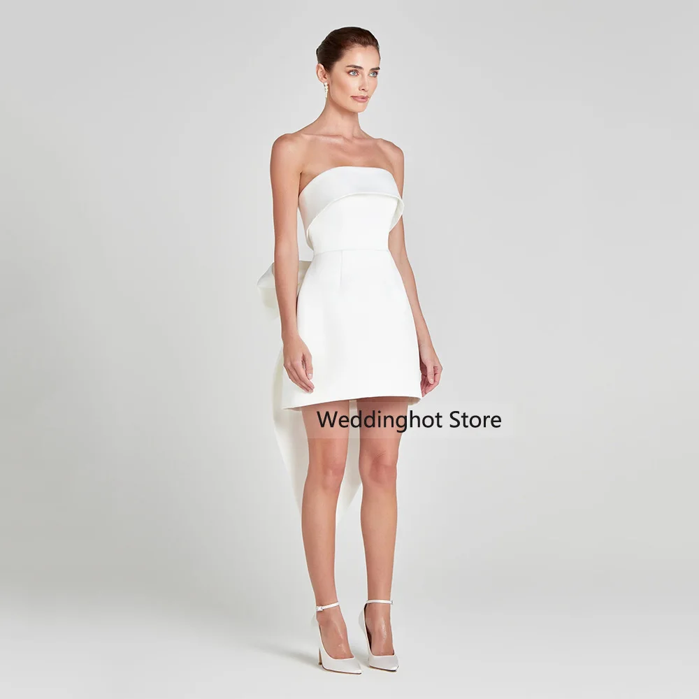 فساتين كوكتيل الزفاف للعروس بدون حمالات بفيونكة كبيرة فساتين كوكتيل صغيرة للنساء 2025 فستان زفاف قصير بدون أكمام