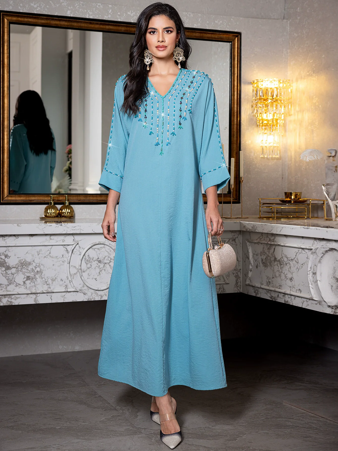 

New Muslim Light Abaya Embellished with Golden Leaf Tassel Adornment for Daily Wear and Festive Occasions in Islamic Communities