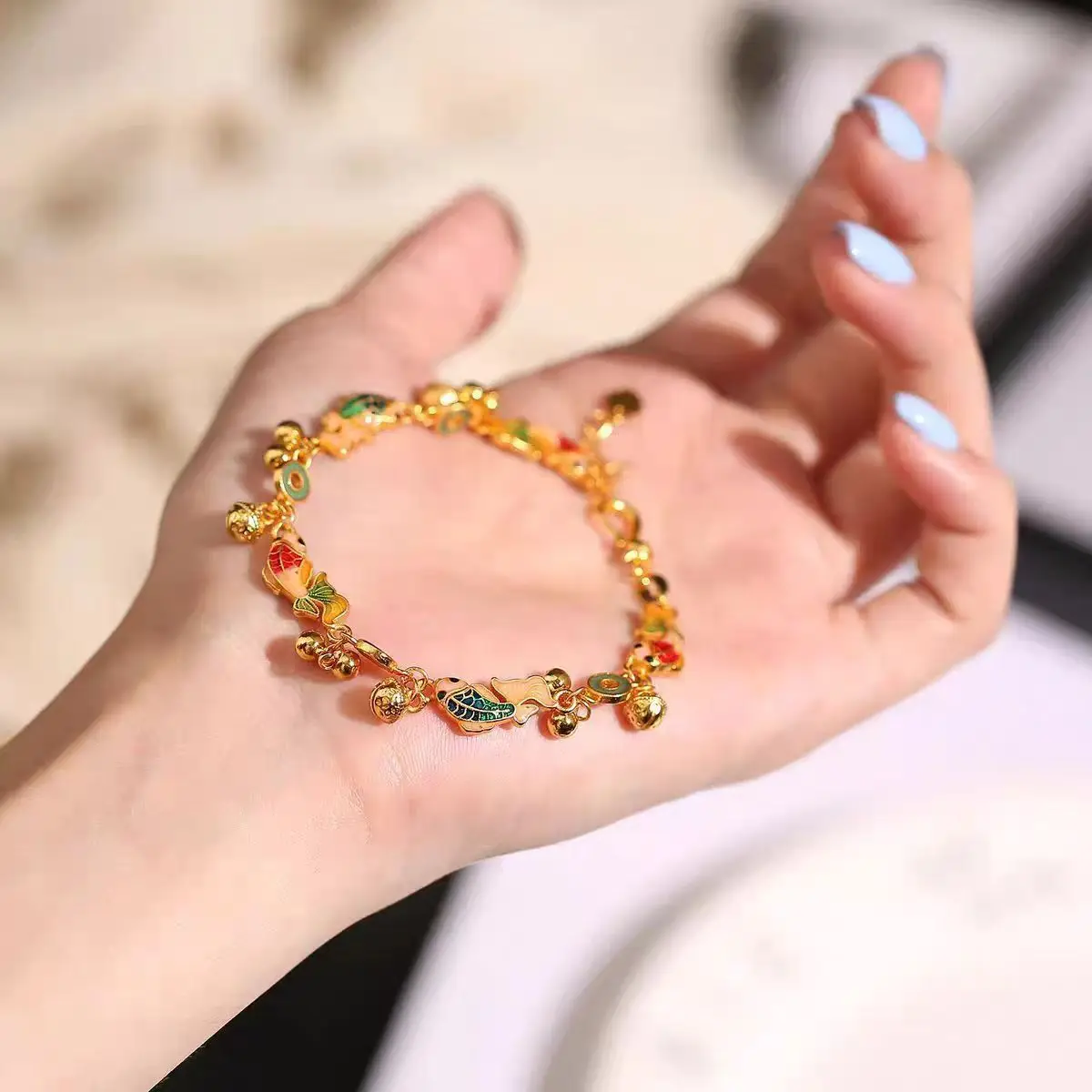 

Enamel Fresh & Luxurious Bracelet (Women's), 24K Gold, AU999 | Wire-inlaid apsara with sky-blue enamel & ribbon details.